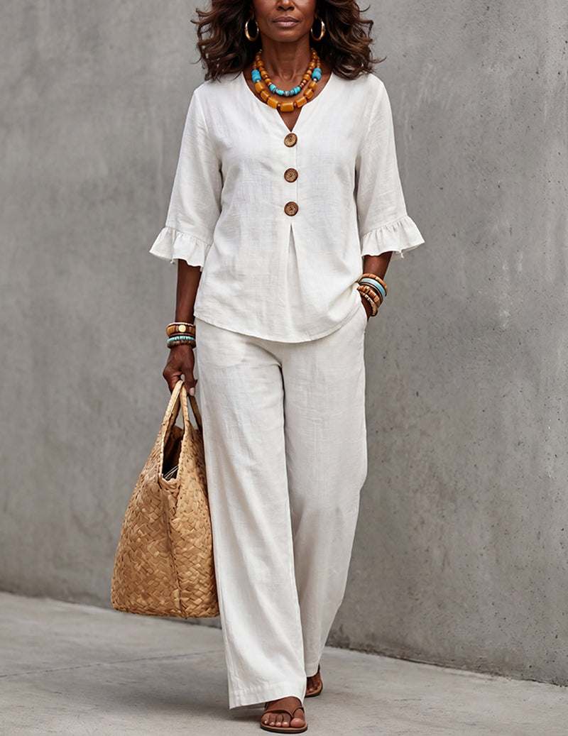 Effortless women's two-piece set featuring a ruffle sleeve top & wide leg trousers, ideal for casual chic spring looks.