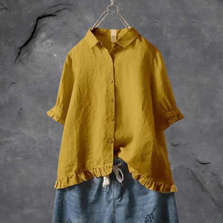 Stylish women's ruffle-trim linen shirt. This button-down summer blouse is a versatile long sleeve top for casual wear.