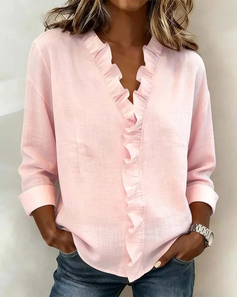Women's ruffle V-neck long-sleeve blouse in a relaxed fit, perfect for elegant spring fashion.