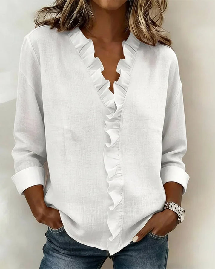 Stylish women's spring blouse with ruffle V-neck and long sleeves, offering casual chic elegance.