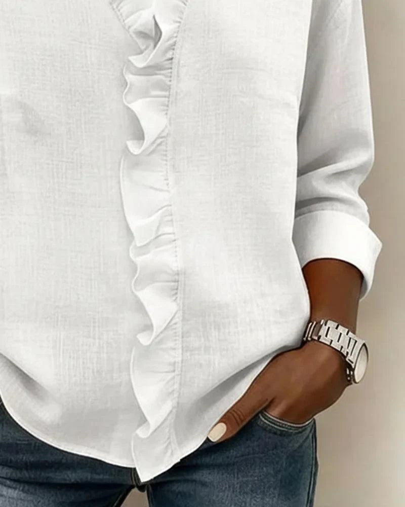 Casual chic women's apparel: ruffle V-neck long-sleeve blouse, an essential for spring fashion.