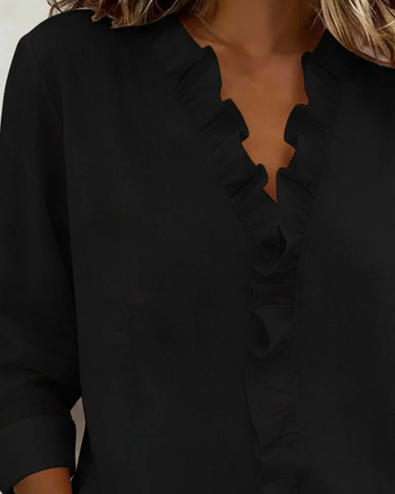 Women's relaxed fit ruffle V-neck long-sleeve blouse, a versatile top for elegant spring everyday wear.