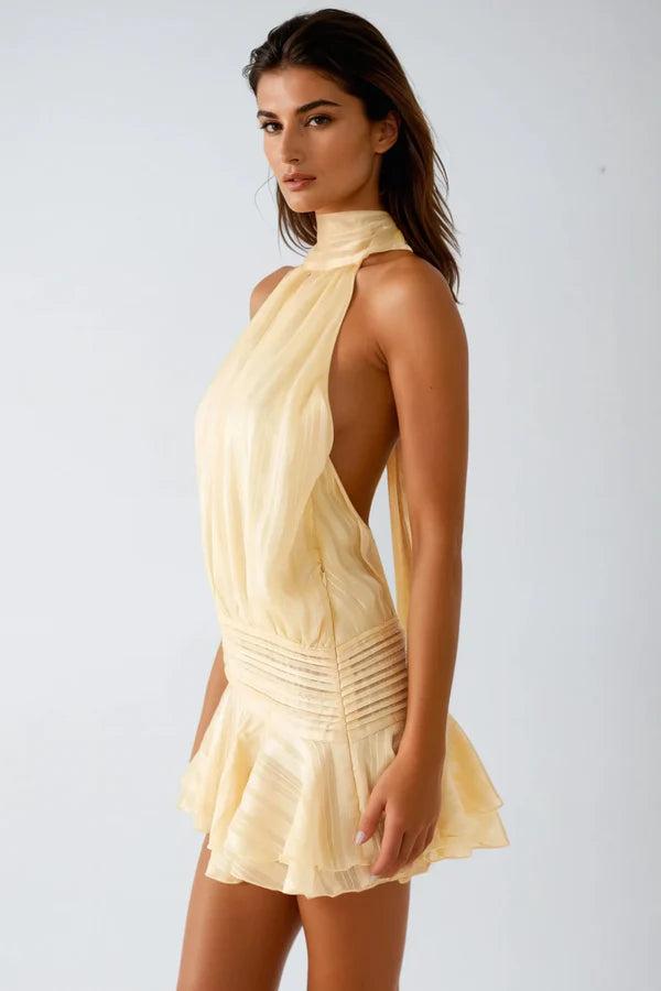 Chic apricot ruffled halter mini dress, a versatile and flattering party outfit for women.