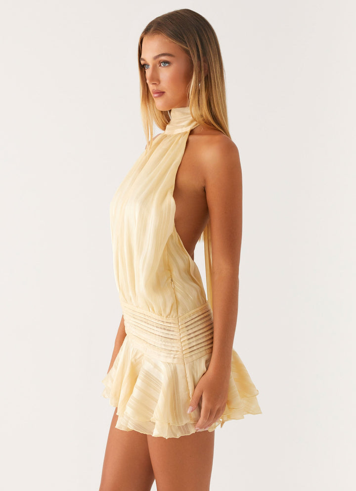 Women's flattering ruffled halter neck mini dress, an elegant choice for cocktail and party wear.