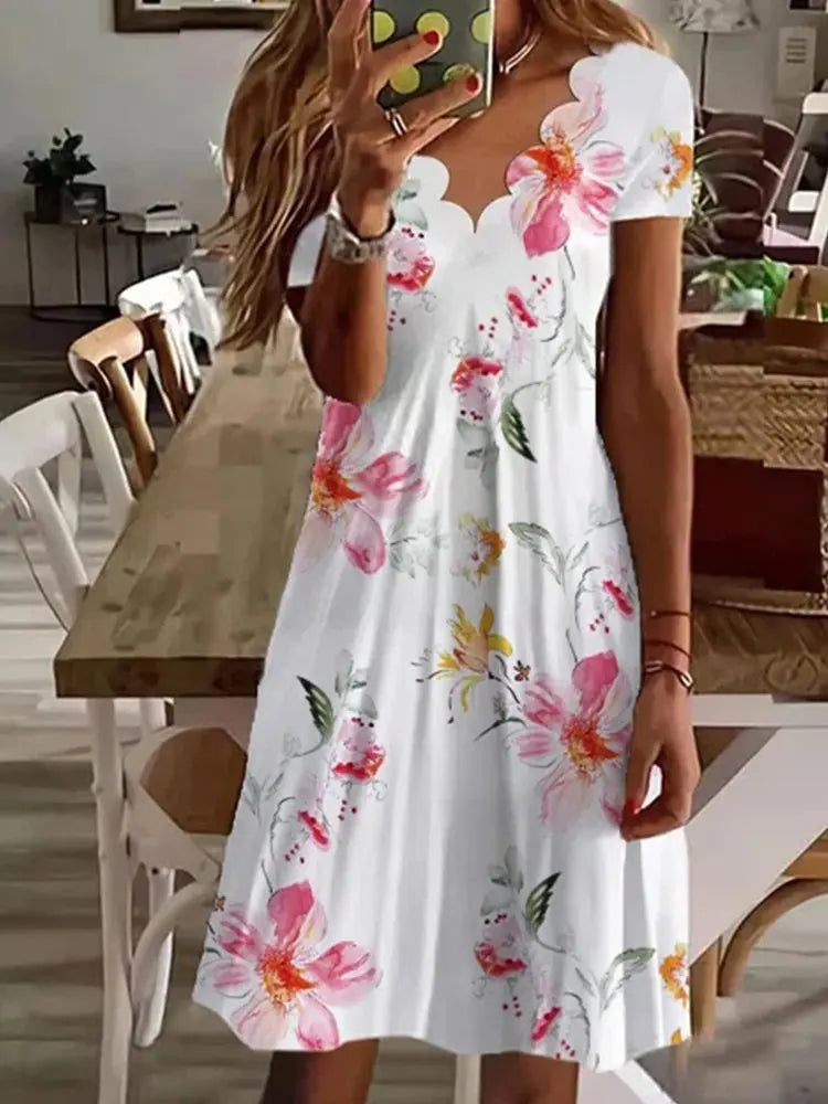 Women's scalloped floral flared midi dress, perfect for elegant summer casual wear or holidays.