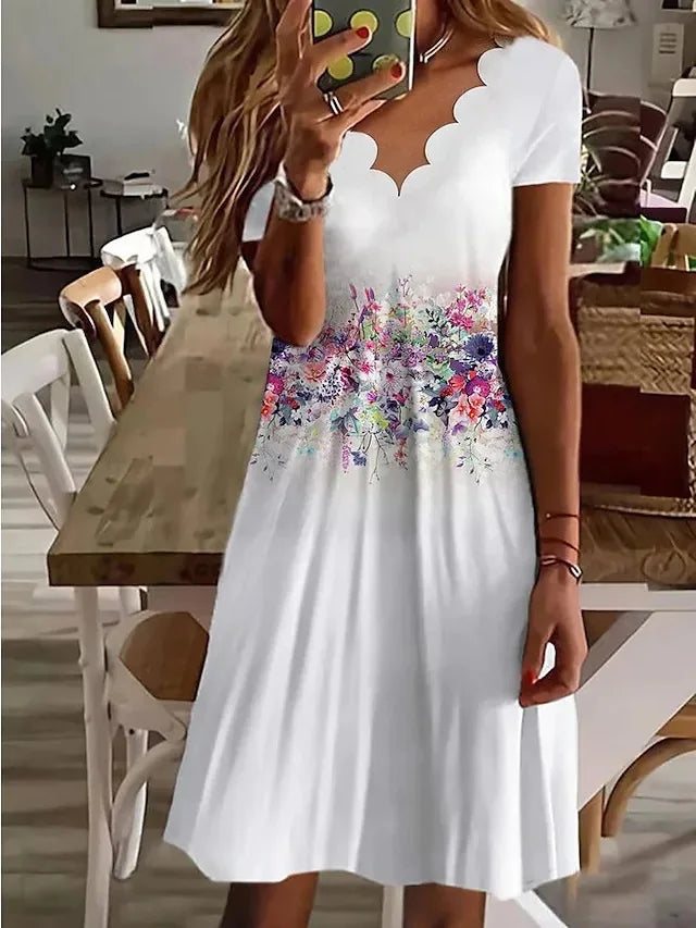 Pullover women's flared midi dress with a flattering fit, back view, adorned with a delicate scalloped floral design.