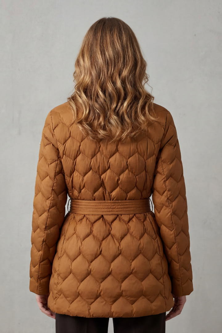 Sculpted fit women's quilted puffer jacket with a chic belt, essential for winter outerwear and layering.