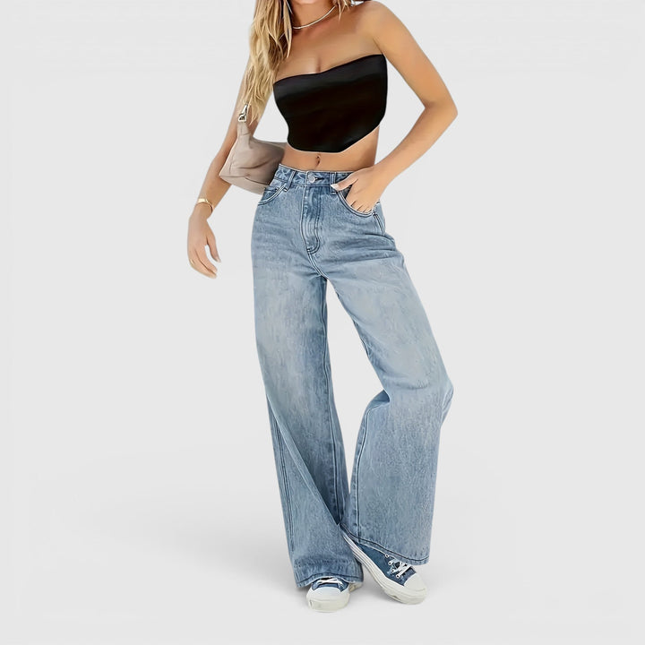 Stylish sea blue denim wide leg baggy jeans for women, offering a loose fit for modern casual wear.