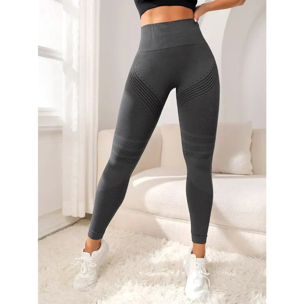 Durable women's high-waist shaping leggings, seamless design for intense workouts & gym sessions.