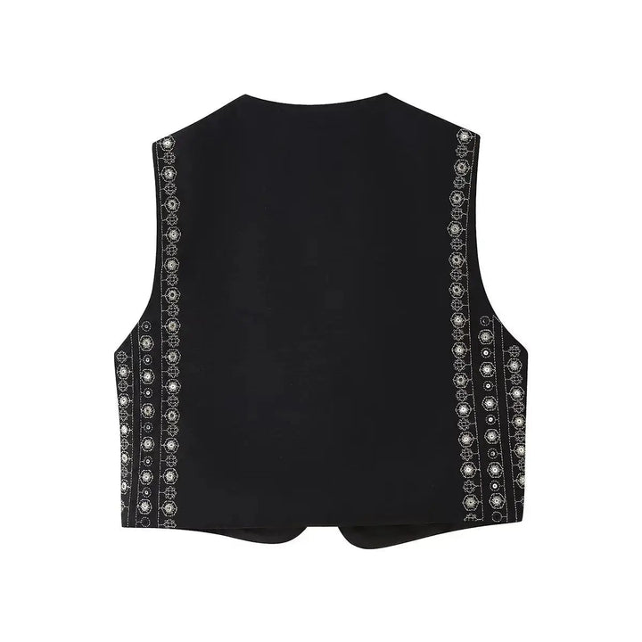 Cropped women's boho vest with intricate sequin embroidery. Ideal sleeveless festival wear & bohemian layering piece.