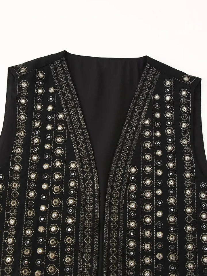 Statement women's sequin embroidered boho vest. Vibrant festival wear, sleeveless bohemian style for layering.