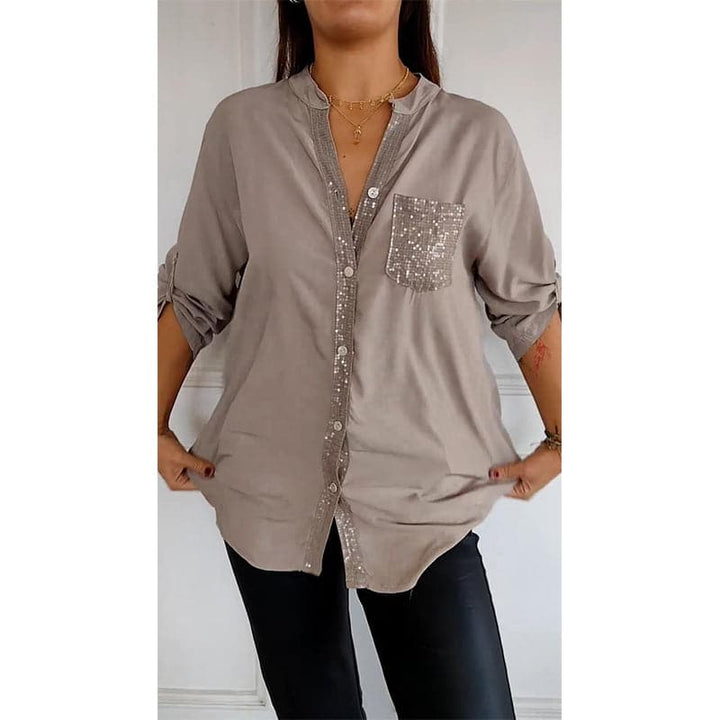 Classic women's button-up shirt with glamorous sequin trim, a perfect sparkle top for any look.