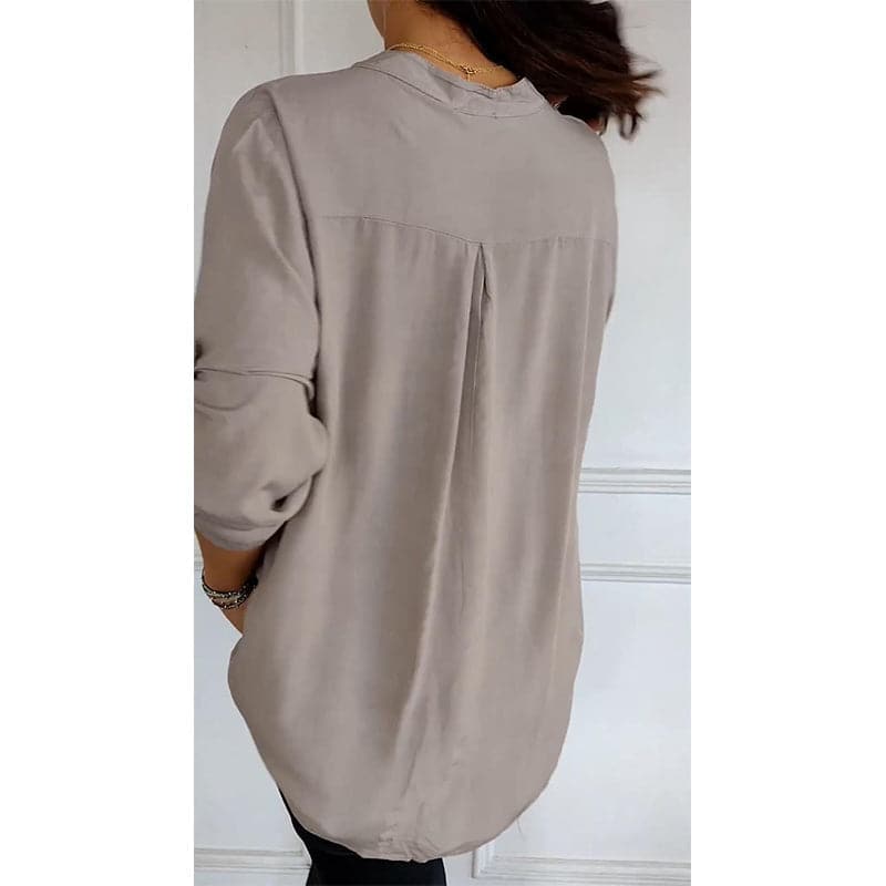 Comfortable, relaxed fit women's button-up blouse with shimmering sequin trim, elegant and chic.