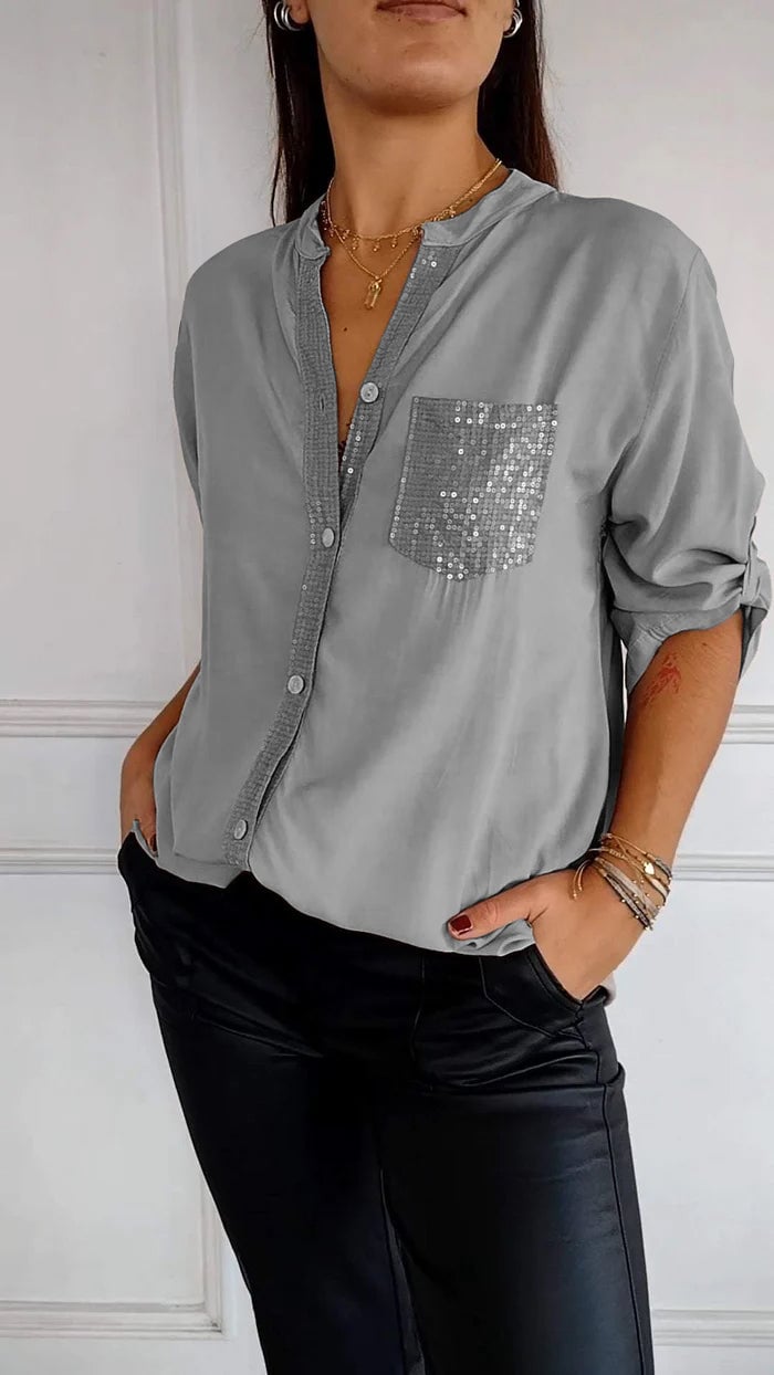 Shimmering women's sequin trim button-up shirt, perfect for holiday events or special evenings out.