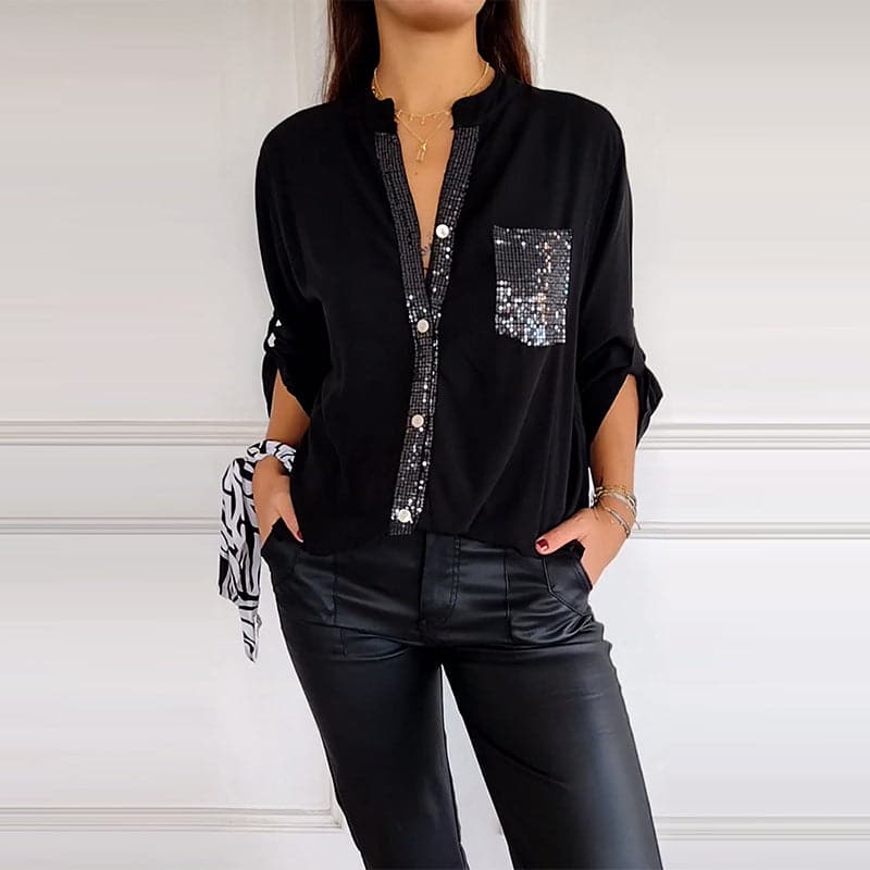 Shimmering women's button-up blouse with delicate sequin trim, offering a touch of sparkle and style.