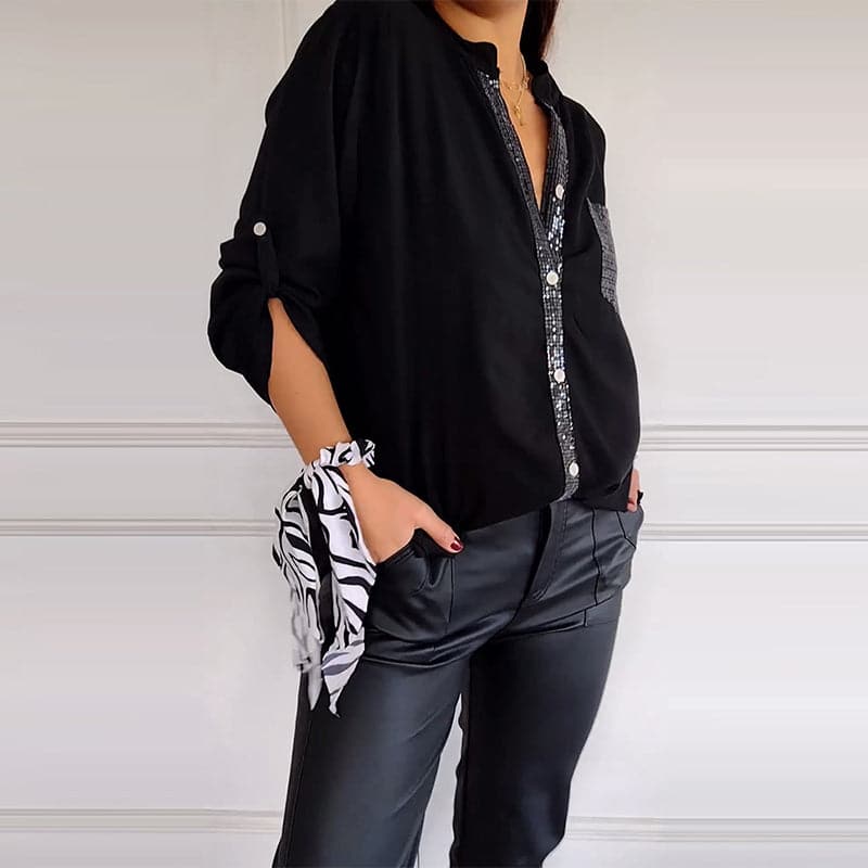 Relaxed fit women's button-up shirt with sequin trim, a versatile and elegant top for any occasion.