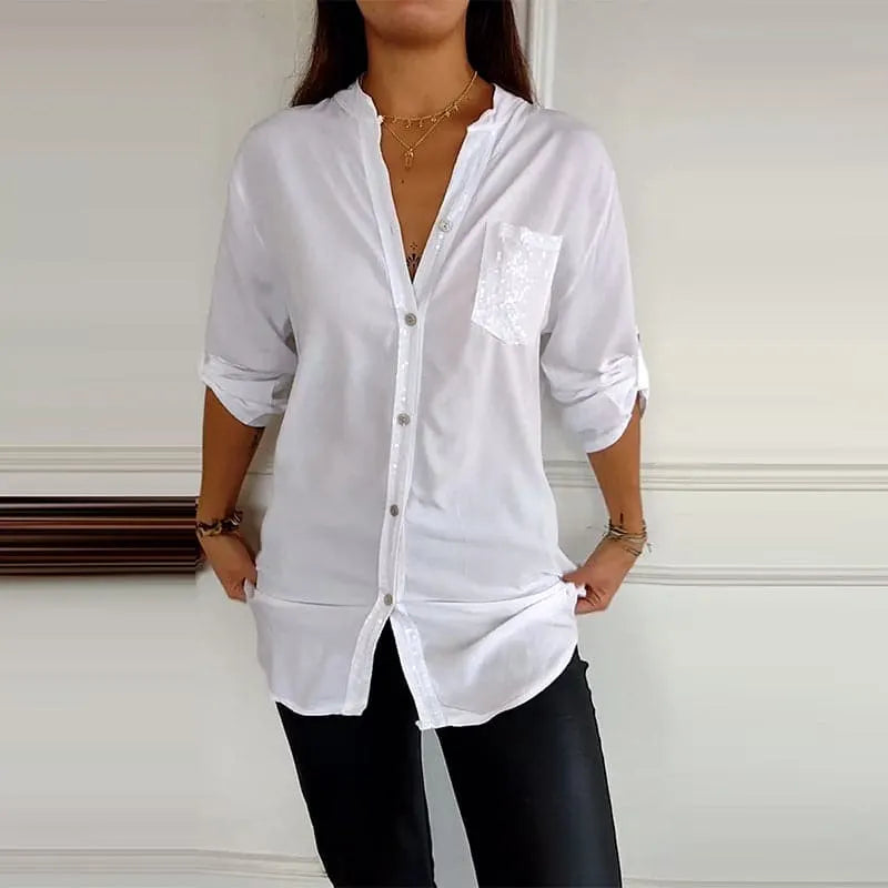 Front view of a women's button-up shirt featuring dazzling sequin trim, a stylish and versatile top.