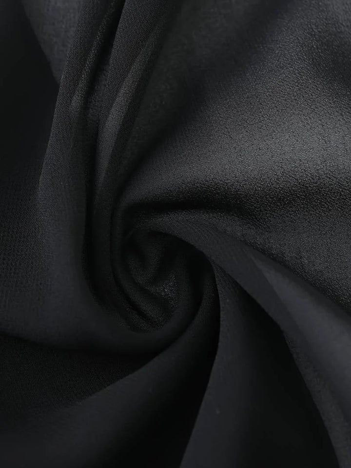 Modern women's sheer open-front blouse with 3/4 sleeves, a stylish tie-front top.