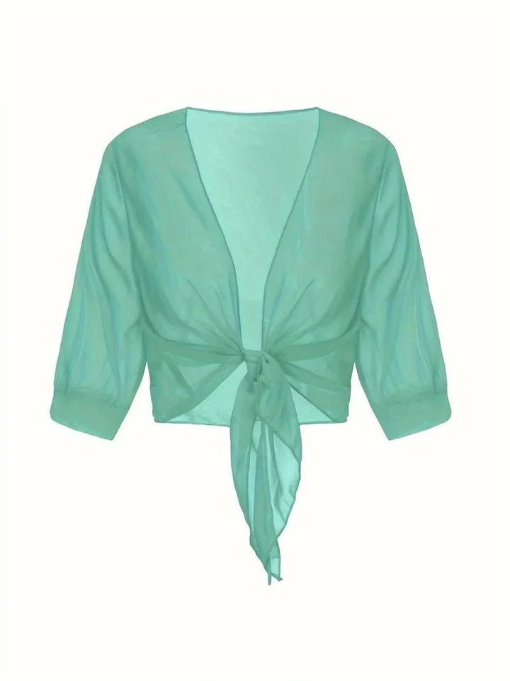 Everyday women's sheer tie-front blouse with 3/4 sleeves, open-front design, relaxed fit.