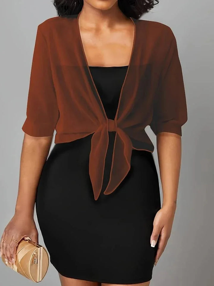 Breezy women's sheer blouse, 3/4 sleeve, with an open-front and adjustable tie closure.