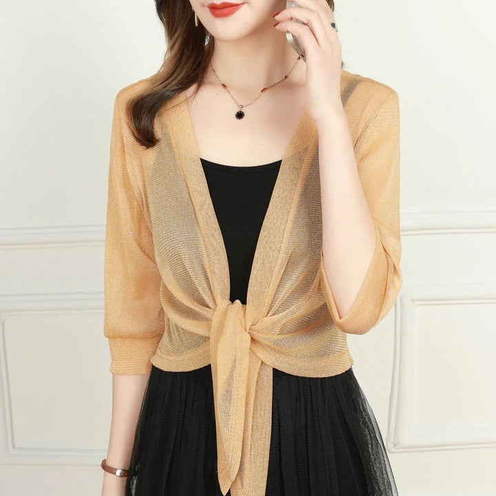 Fashionable women's sheer open-front blouse, 3/4 sleeves, and a flattering tie-front detail.