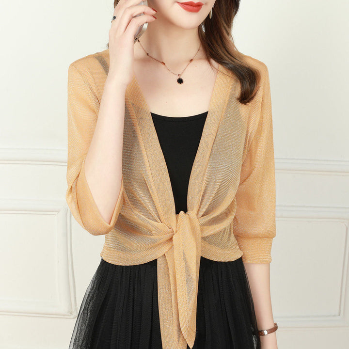 Women's cropped sheer bolero top with tie front closure, ideal for elegant occasion wear layering.