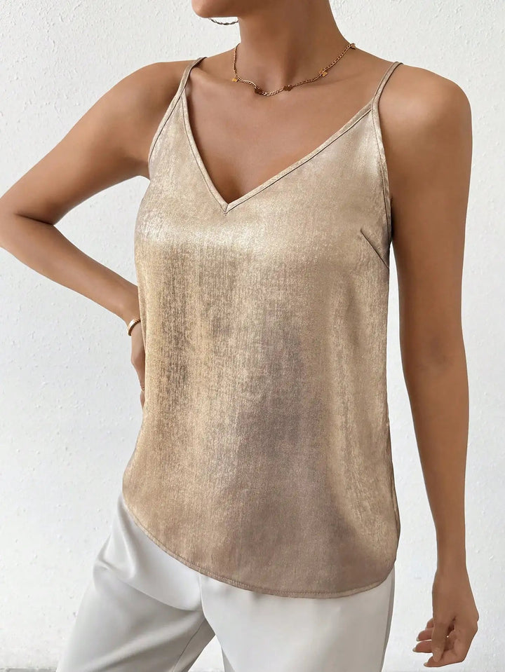 Stylish metallic V-neck camisole top for women, sleeveless and shimmering, ideal for summer evenings.