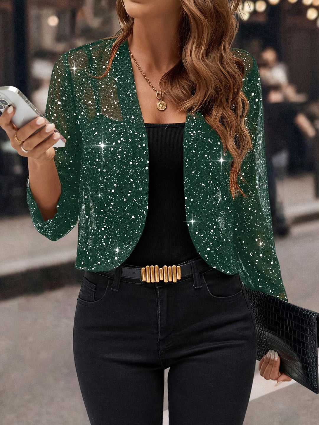 Elegant women's sequin jacket with glitter shimmer, a stylish layering piece for evening.