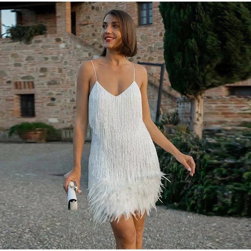 Glamorous women's sequin fringe mini dress with spaghetti straps, perfect for evening parties.