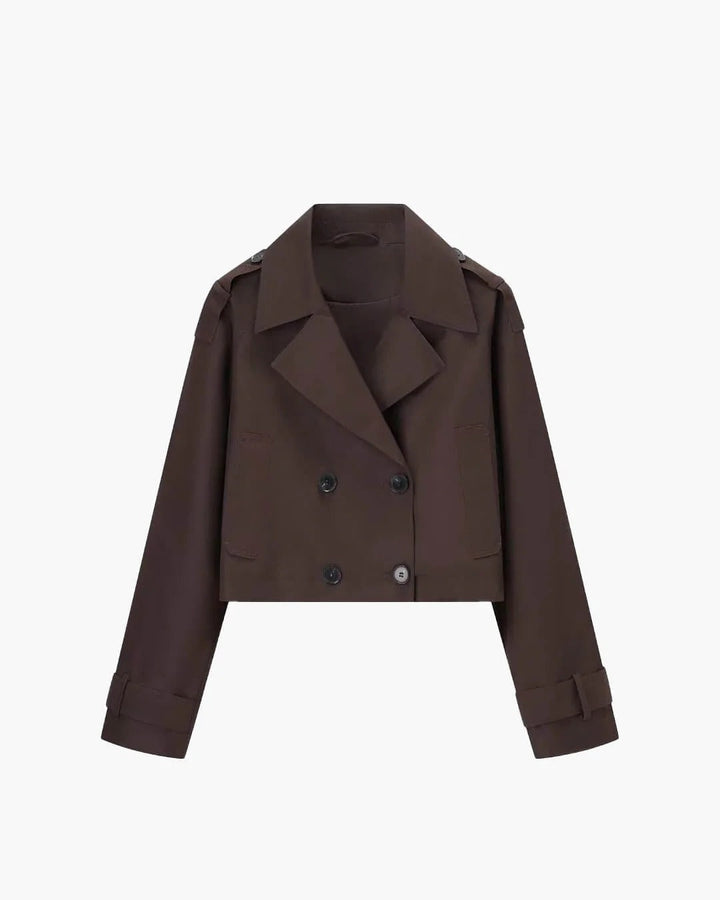 Fashionable women's short double-breasted trench coat. Elegant coffee outerwear, a classic for smart casual style.