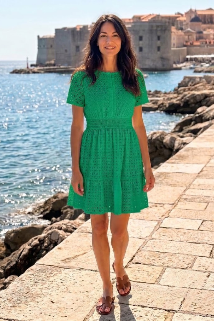 Stylish women's short flutter sleeve eyelet mini dress, a chic & casual summer day dress with tiered hem.