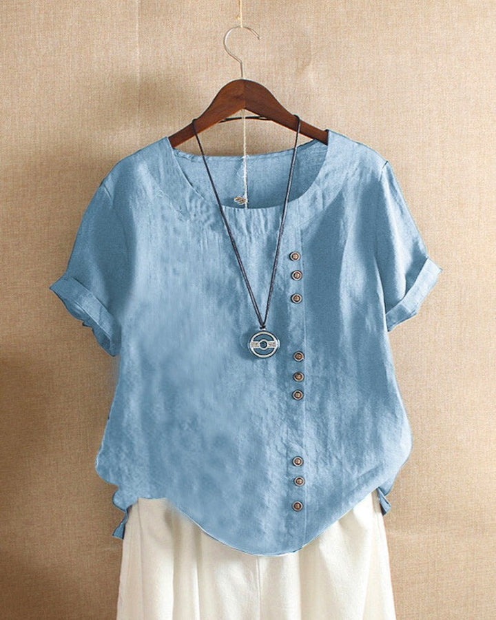 Simple yet chic women's short sleeve blouse with functional button details, great for everyday casual style.