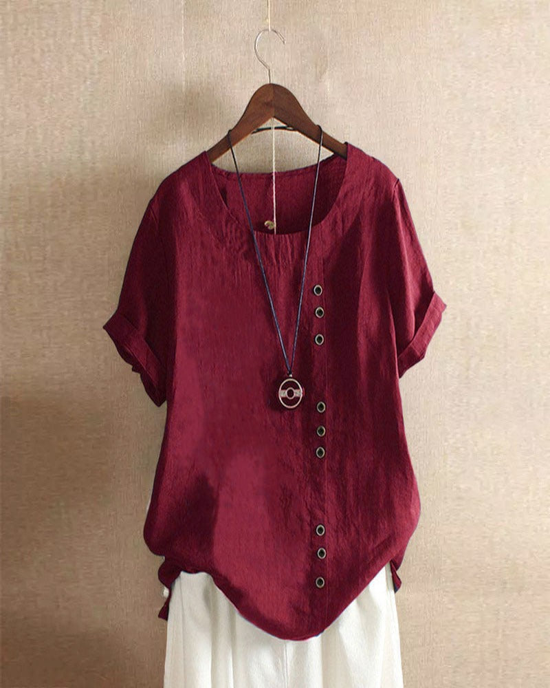 Effortless style women's short sleeve blouse, featuring decorative button details for a chic and relaxed summer top.