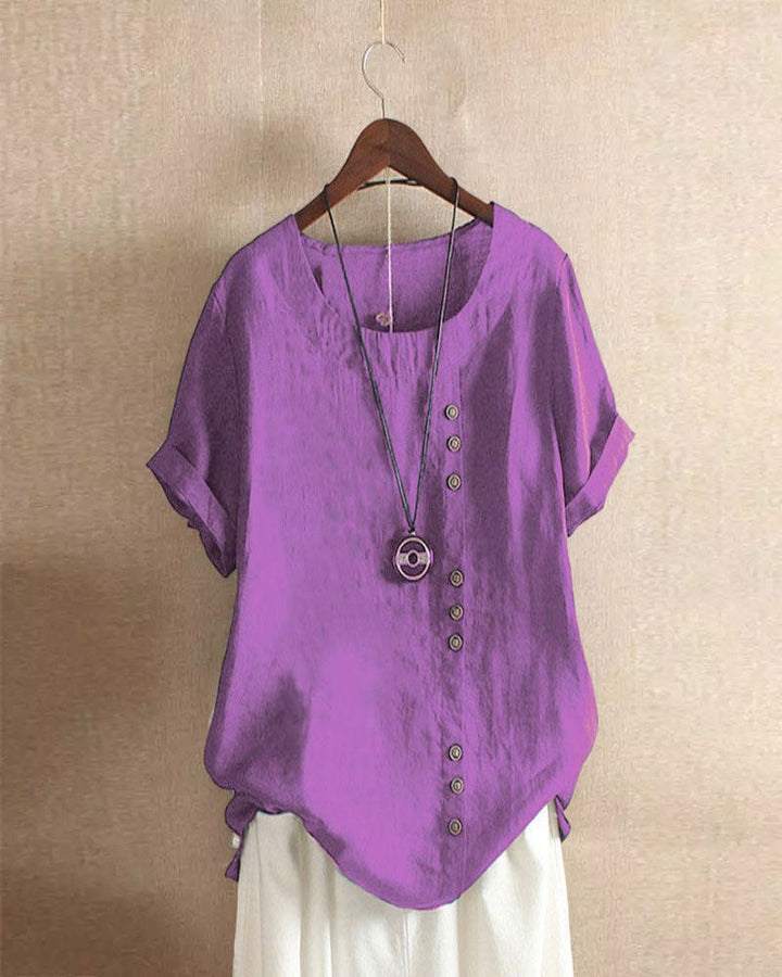 Comfortable women's short sleeve blouse with stylish button accents, perfect for versatile everyday summer fashion.