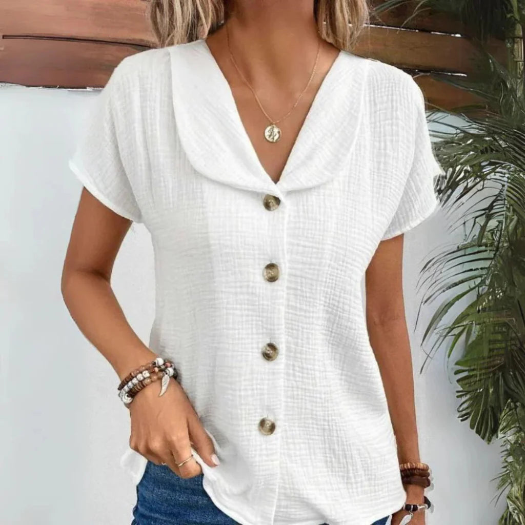 Women's short sleeve button-down blouse with a stylish collar. Perfect for versatile casual or elegant everyday wear.
