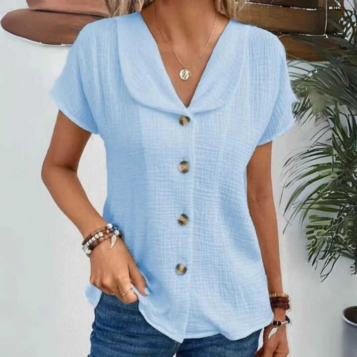 Versatile women's short sleeve collared blouse. A casual yet elegant button-down top for comfortable everyday wear.