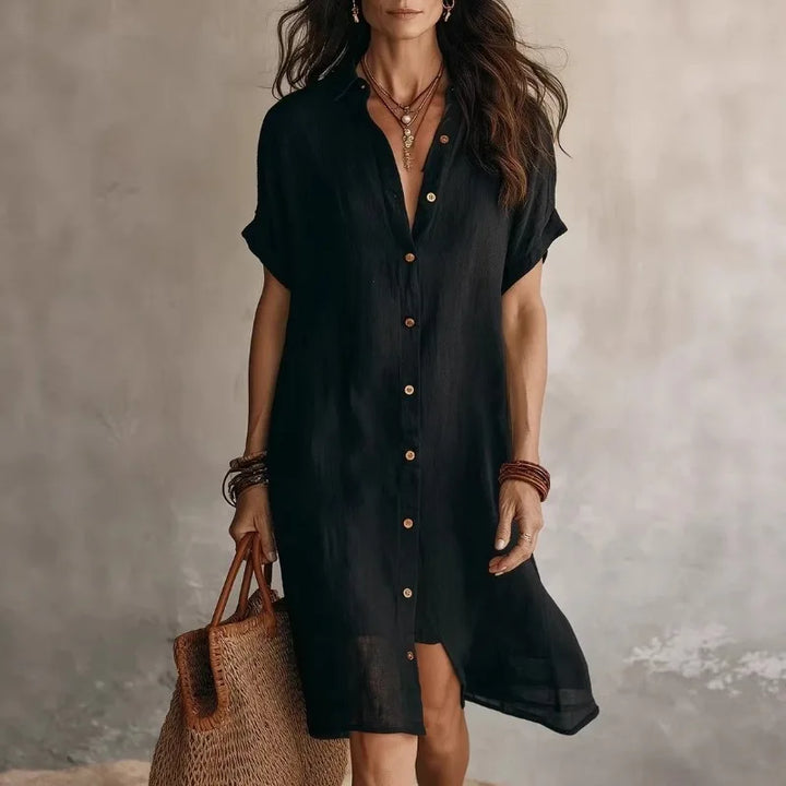 Women's short sleeve button-front midi shirt dress, elegant & versatile for smart casual wear.