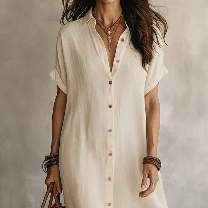 Stylish women's short sleeve midi shirt dress, button-front design, great for smart casual elegance.