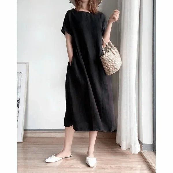 Women's short sleeve linen midi dress. Relaxed fit, everyday casual summer style with practical pockets.