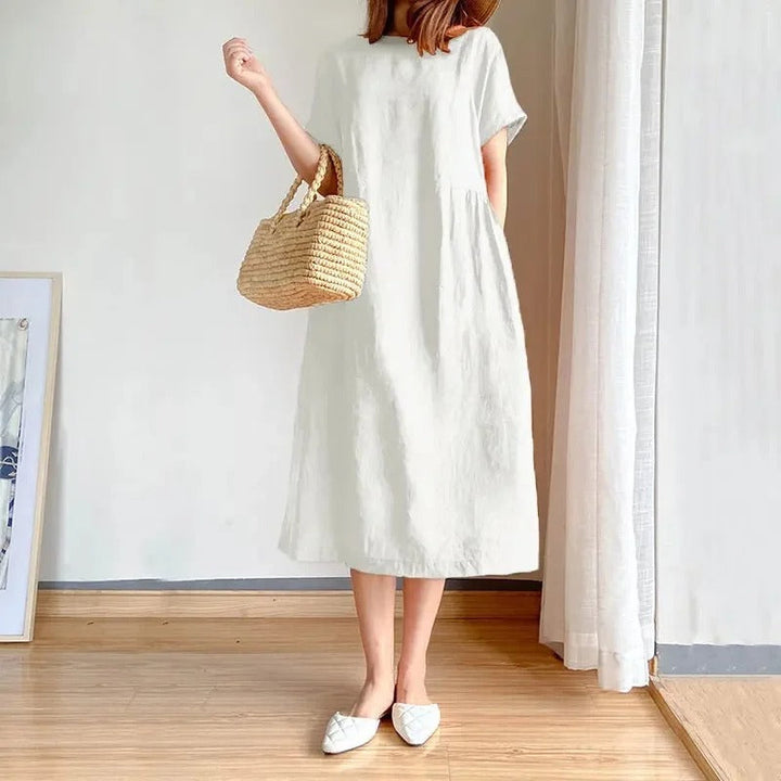 Comfortable women's short sleeve linen midi dress. Effortless style for versatile everyday wear and summer outfits.