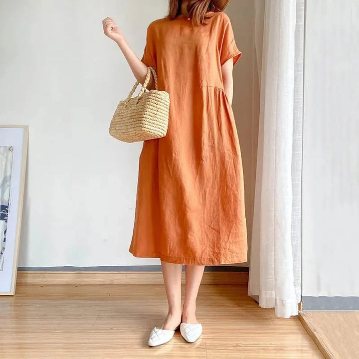 Linen short sleeve midi dress for women. Relaxed, comfortable fit, ideal for casual summer and versatile everyday wear.