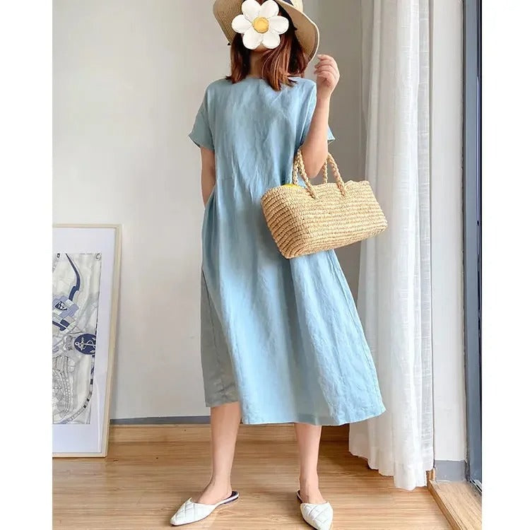 Effortless women's short sleeve linen midi dress with practical pockets. Casual, relaxed, perfect for summer comfort.