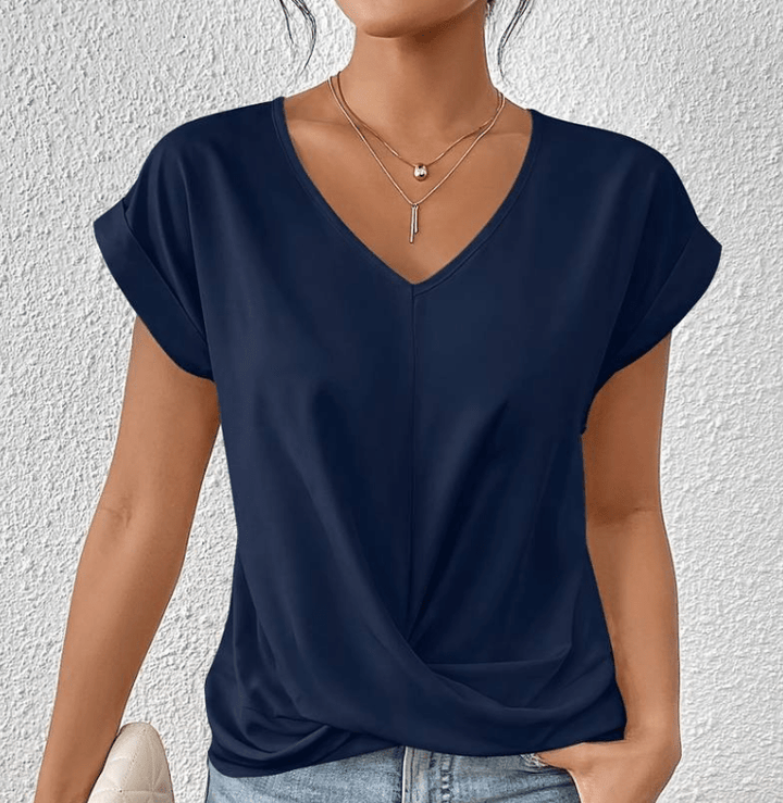 Comfy women's twist front V-neck blouse, versatile for everyday wear. Relaxed fit short sleeve summer top.