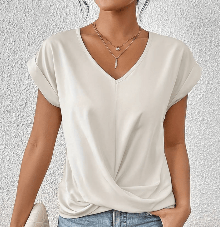 Elegant women's short sleeve V-neck top with unique twist front, ideal for stylish casual summer outfits.