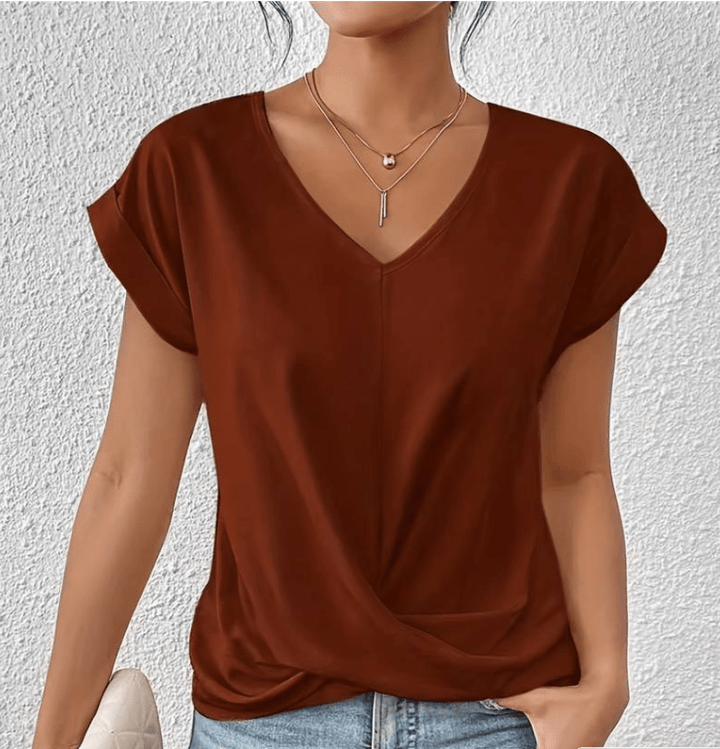 Relaxed fit women's summer top, featuring a flattering V-neck and stylish twist front, great for casual days.