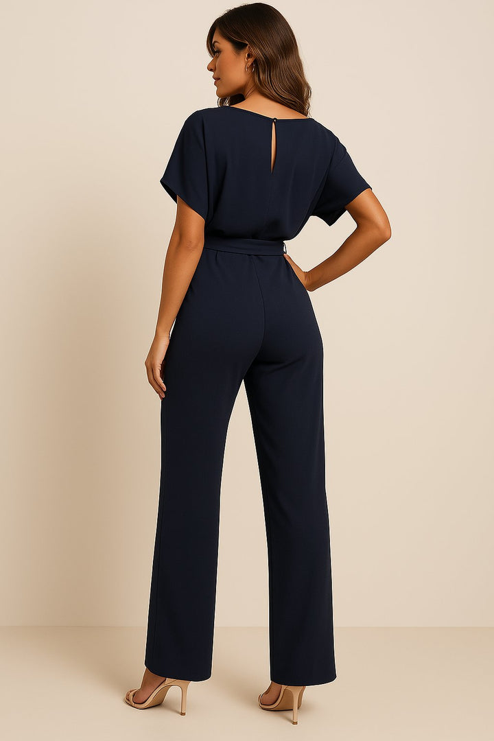 Modern women's one-piece jumpsuit with wide legs, short sleeves, and a belted waist for ultimate comfort.
