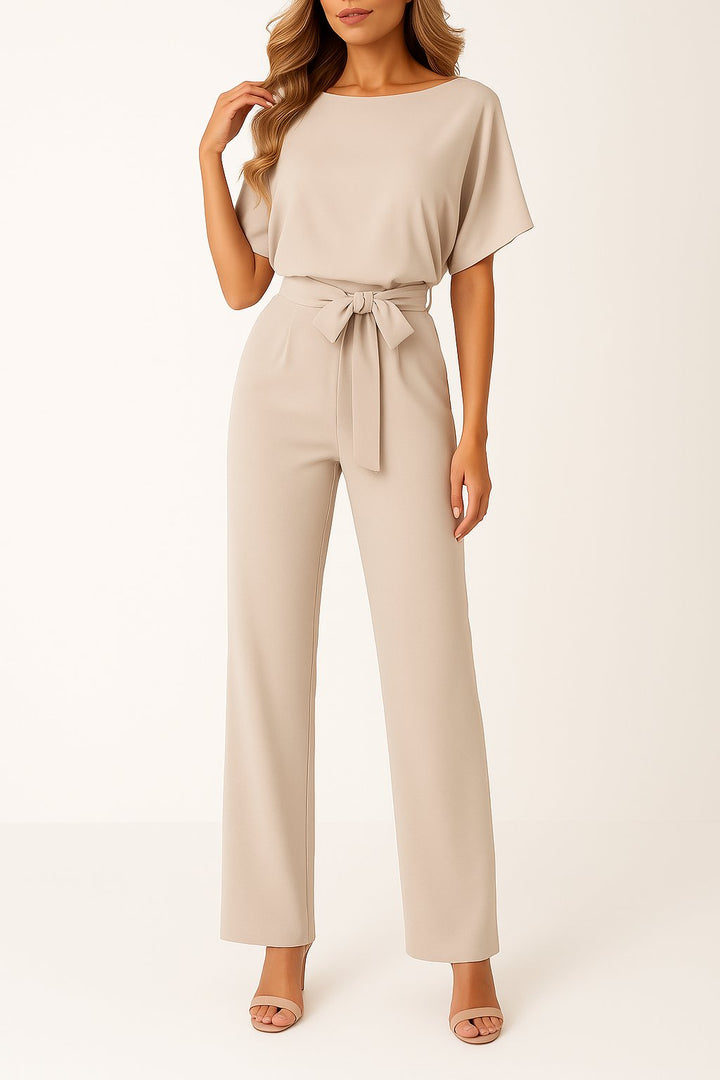 Elegant belted wide-leg jumpsuit for women; features short sleeves, perfect for casual or formal wear.