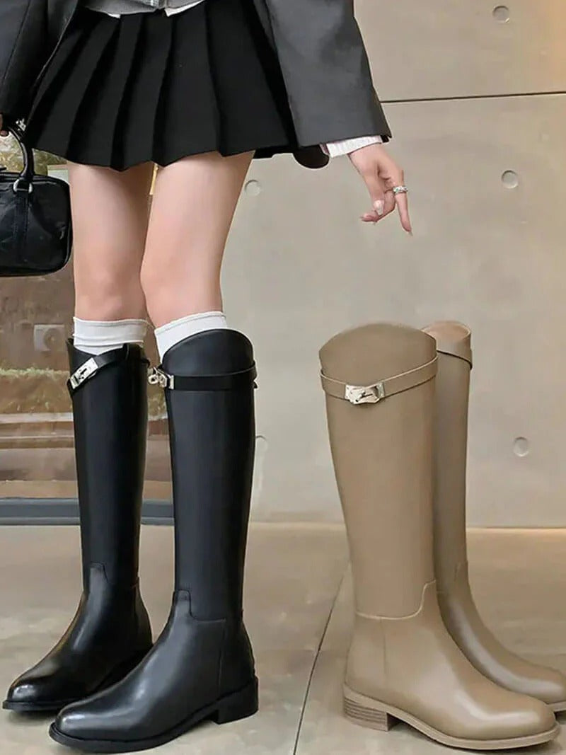 Sleek fit women's knee-high boots. Stylish, tall, structured fashion footwear for elegant autumn/winter looks.