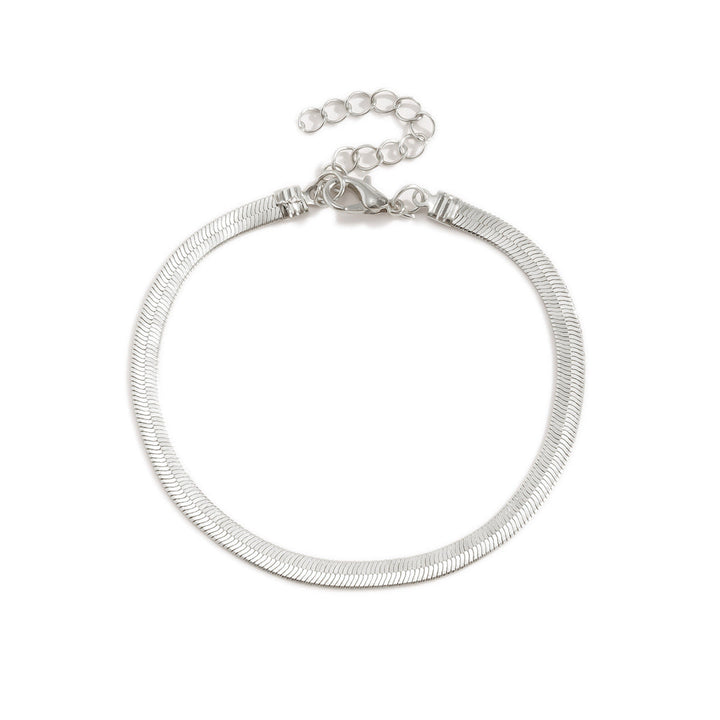Women's sleek gold snake chain bracelet, a versatile and adjustable piece of fine jewelry.