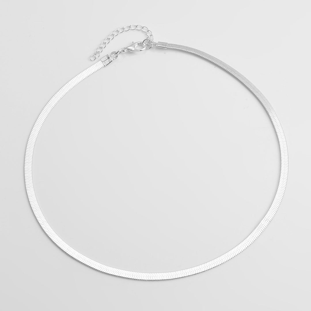Elegant women's gold snake chain necklace. A minimalist fashion accessory, ideal for layering and daily wear.